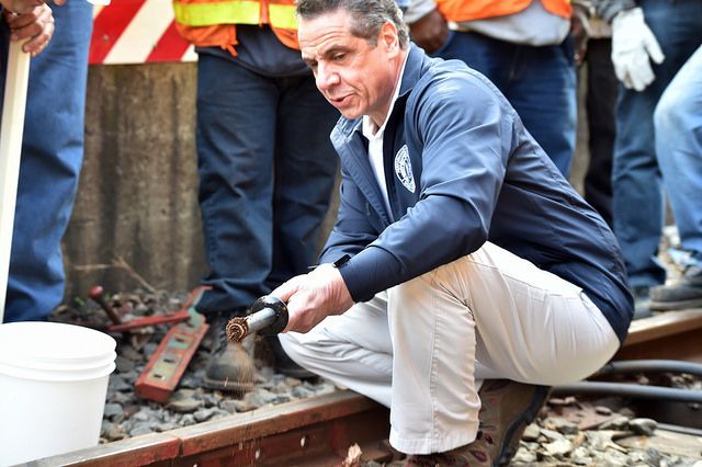Governor Andrew Cuomo demonstrates his use of a magnetic wand at the 9th Avenue subway station on the D Line in Sunset Park